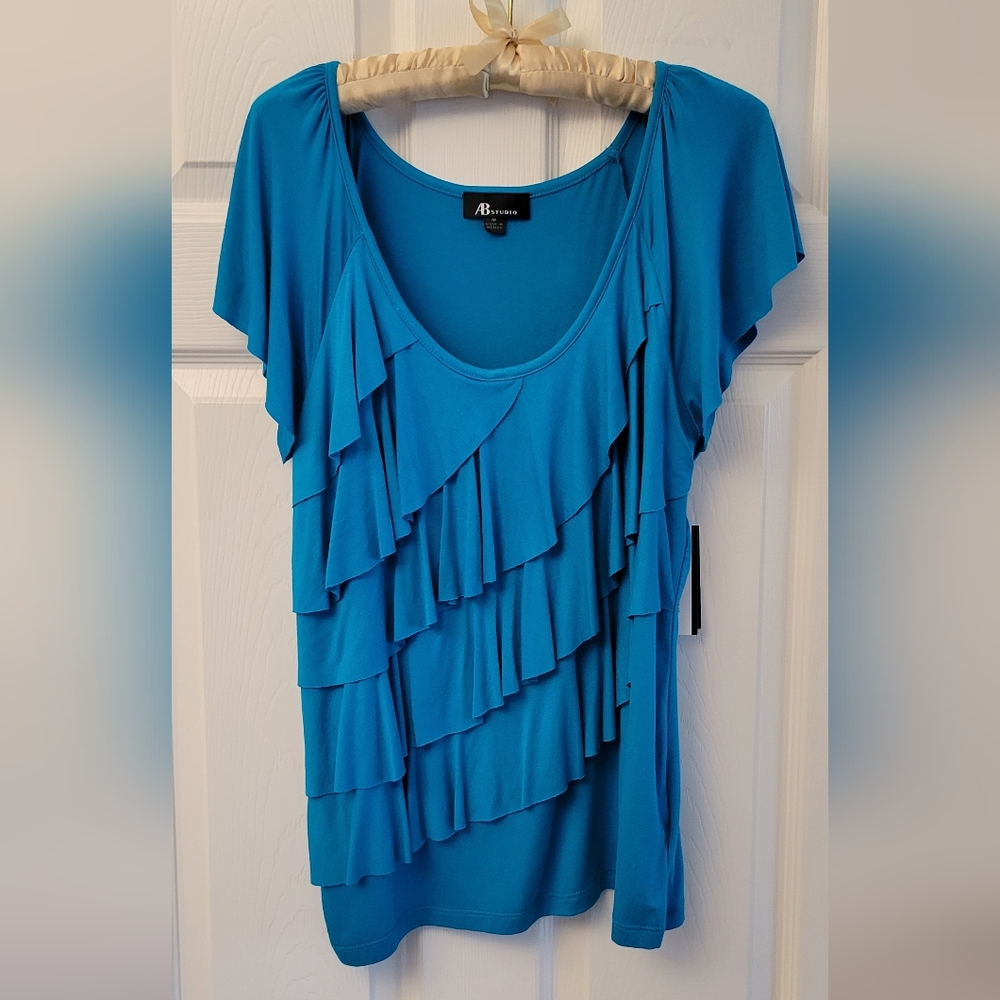 Ocean blue short sleeve ruffle women’s shirt size medium. NWT